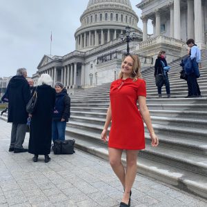 Taylor Kane stands in front of Capitol Building in Washington D.C.